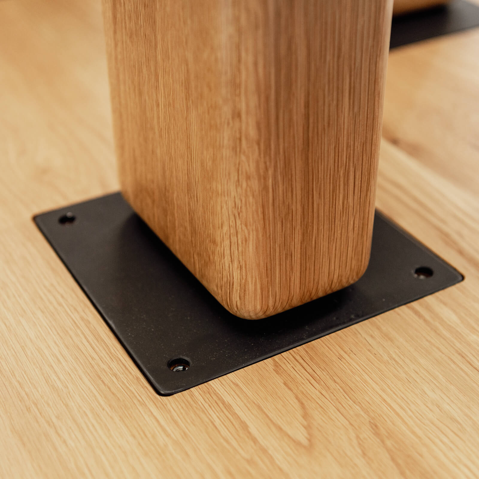 Banquette table leg with custom metal fabrication inset table leg