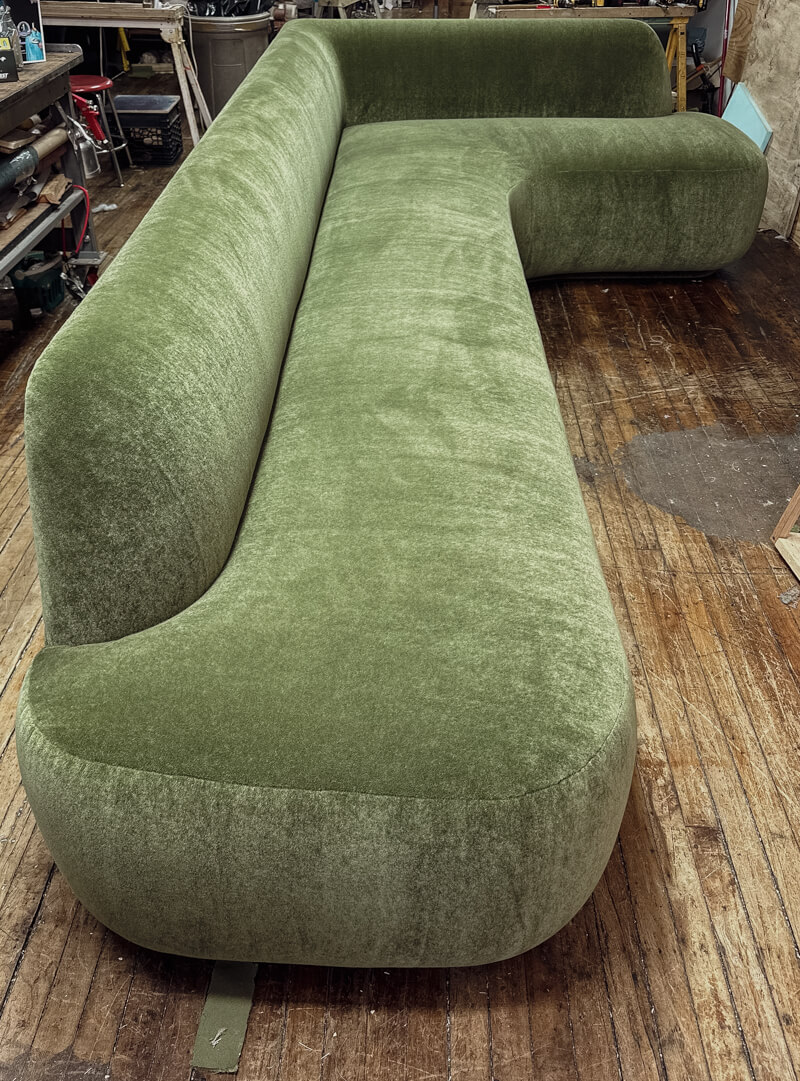 Custom made sofa with hand-tied springs upholstered in green mohair fabric