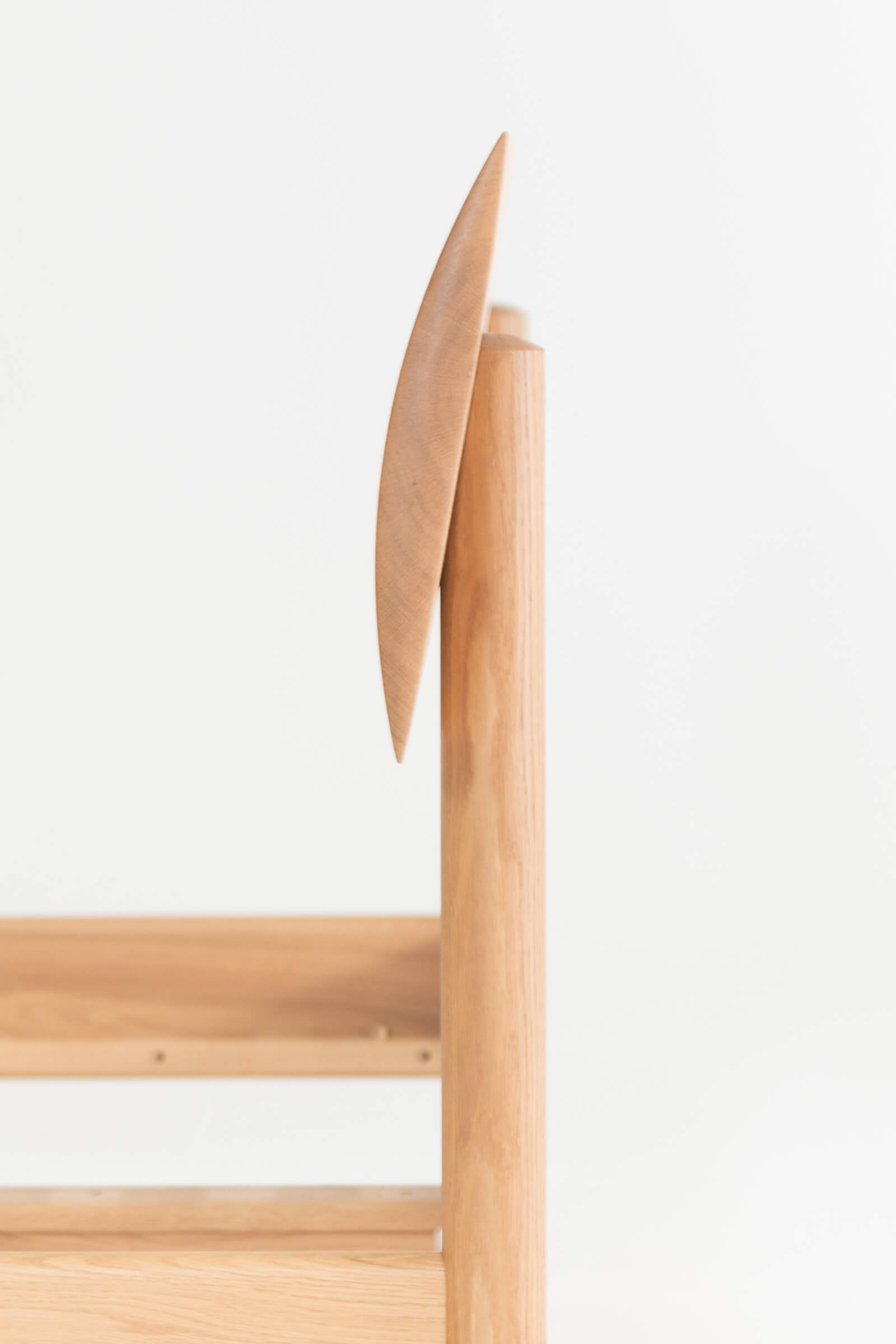 Custom solid oak sculpted headboard side view